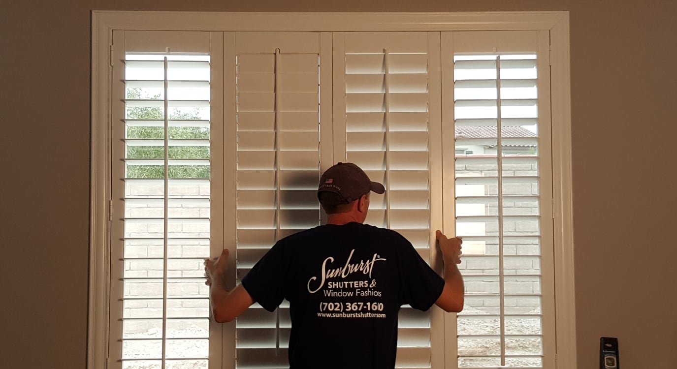Plantation shutters being installed in a home